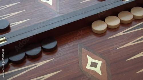 Rolling two dice on a Backgammon setting, the dice coming up as a 4 and a 6. Set of four different rolls.