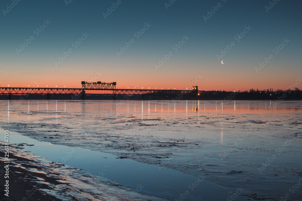 Naklejka premium Early morning on the river coast. New moon.