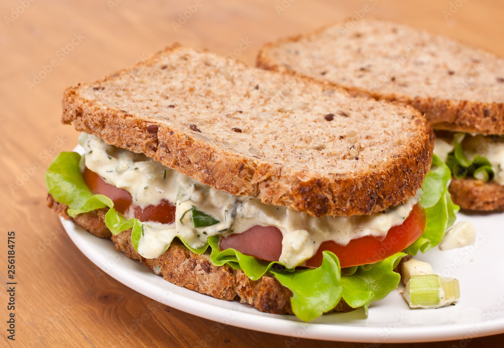 egg salad sandwiches on brown toasted bread egg salad sandwiches on brown toasted bread
