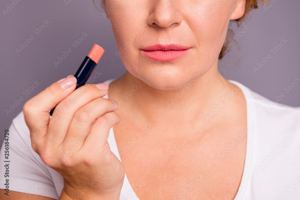 Cropped close up photo beautiful amazing mature she her lady hold new collection pomade applying putting great result lipgloss go romantic date wear white t-shirt isolated grey background