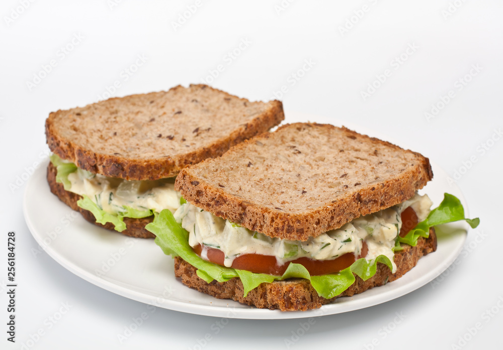 egg salad sandwiches on brown toasted bread egg salad sandwiches on brown toasted bread