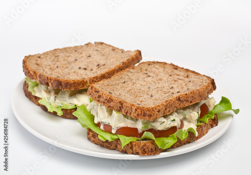 egg salad sandwiches on brown toasted bread