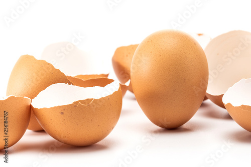 One egg stand up whire other has cracked on right position photo