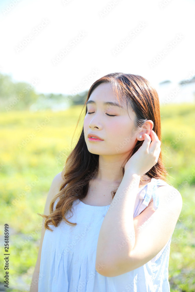 Portrait of Young Asian woman girl smile in flower garden Portrait of Young Asian woman girl smile in flower garden