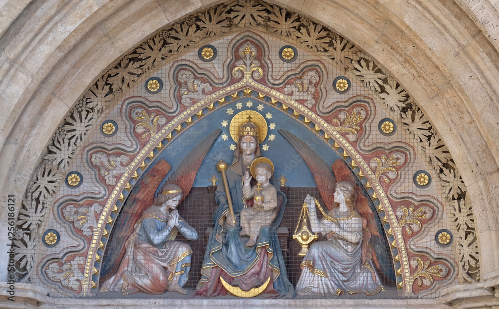 Virgin Mary with baby Jesus and Angels, statue from portal of the church of St. Matthew near the fisherman bastion in Budapest, Hungary