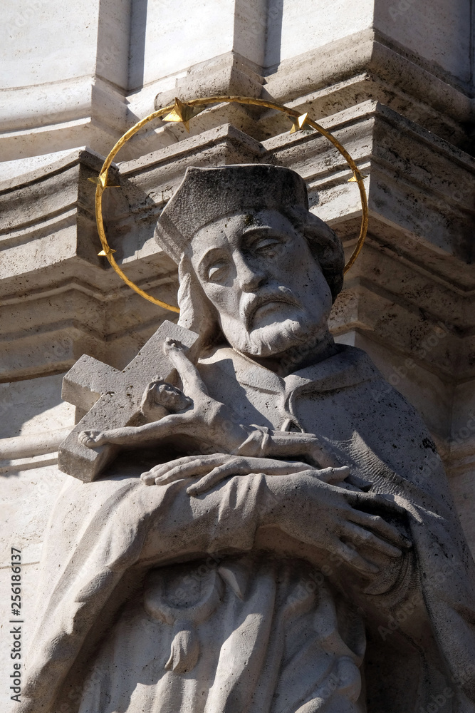 Obraz premium Statue of Saint John of Nepomuk, detail of Holy Trinity plague column in front of Matthias Church in Budapest, Hungary