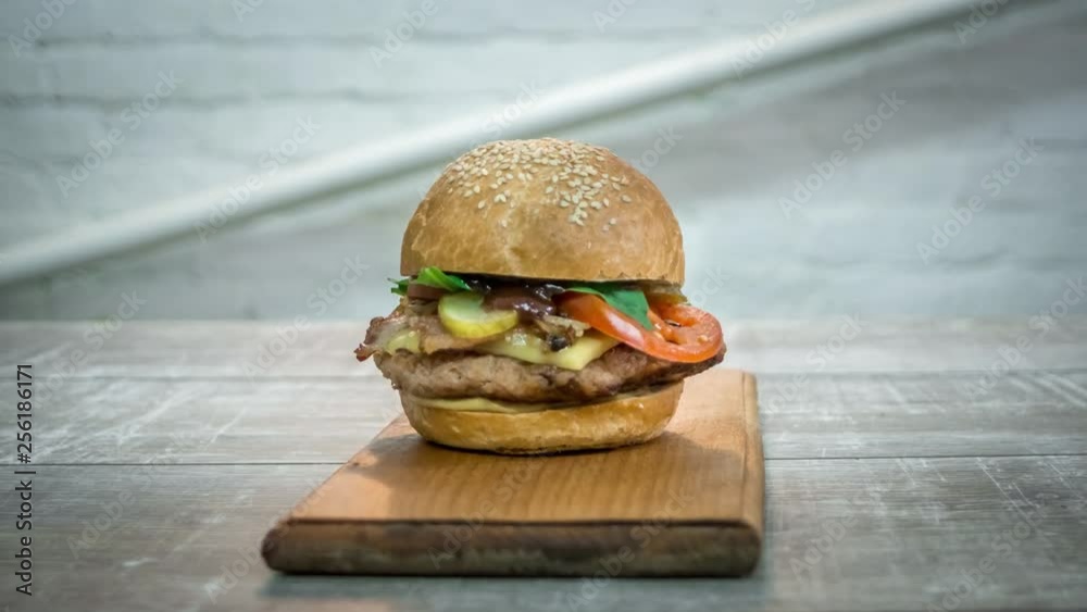 Stop motion animation of burger cooking, rotating of ready burger, 4k