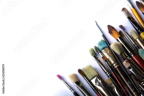 Set of paint brushes for drawing, on white background. Copy space. Frame.