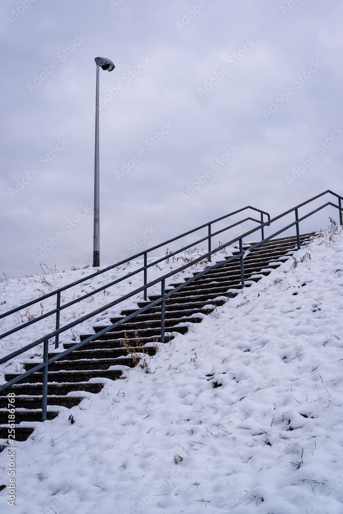 Street lamp and stairs on the embankment in snow, Zagreb, Croatia Street lamp and stairs on the embankment in snow, Zagreb, Croatia