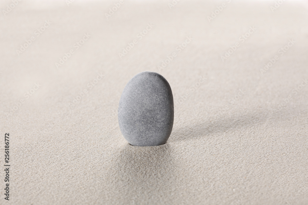 zen stone concept: grey stoneson the sand with copy space for your text zen stone concept: grey stoneson the sand with copy space for your text