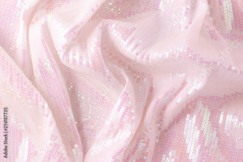 Large shiny glossy pink sequins background.