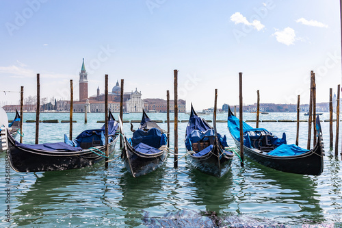 Empty gondolas floating on a lagoon of Venice  Italy