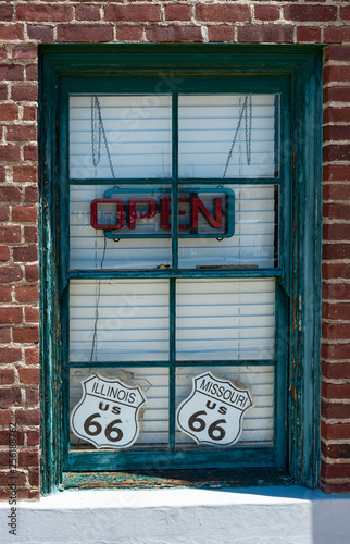 Open neon sign in the window of a vintage cafe on Route 66