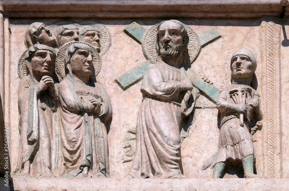Path towards the Calvary, relief on Facade of Sant`Anastasia Church in Verona, Italy Path towards the Calvary, relief on Facade of Sant`Anastasia Church in Verona, Italy