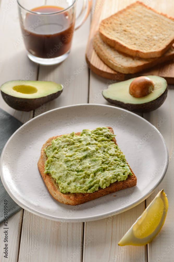 Halved and mashed avocado Halved and mashed avocado
