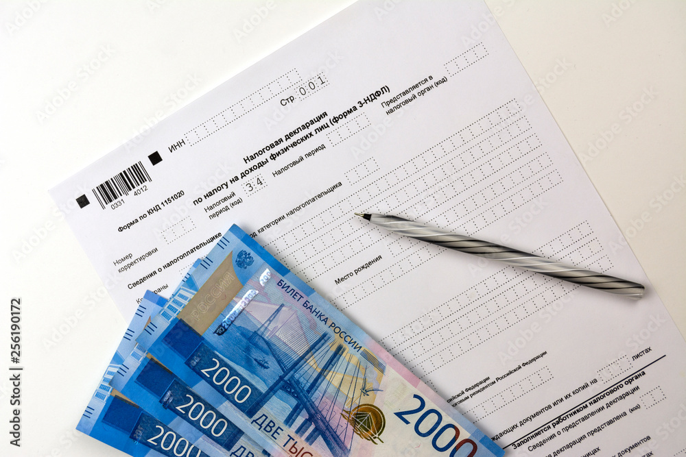 Russian documents, income Declaration Form 3-NDFL, cash 2000 rubles and a pen Russian documents, income Declaration Form 3-NDFL, cash 2000 rubles and a pen