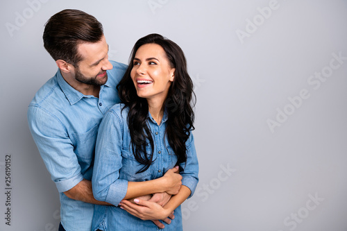 Crazy fellows. Portrait of handsome satisfied carefree bonding hipsters millennial laughing fooling feeling tender cozy comfort cuddles wearing blue denim shirts on silver background