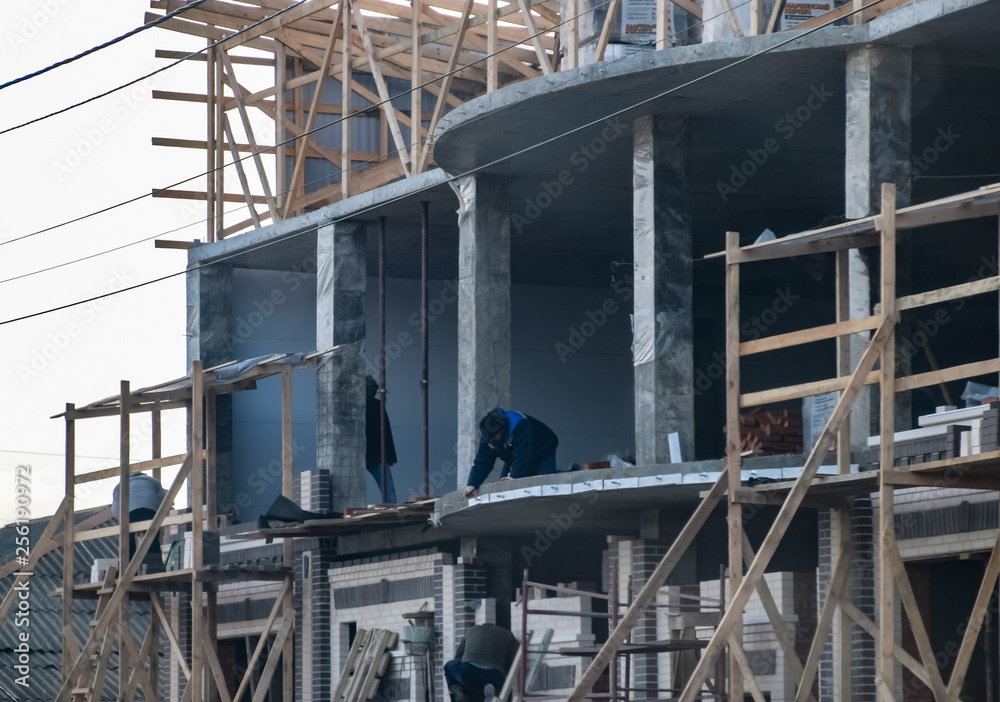 Construction of a multistorey residential building. Share constr Construction of a multistorey residential building. Share constr