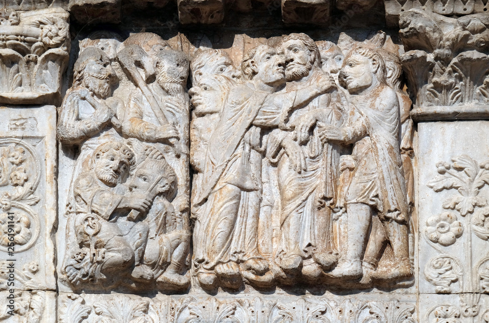 The Kiss of Judas, medieval relief on the facade of Basilica of San Zeno in Verona, Italy