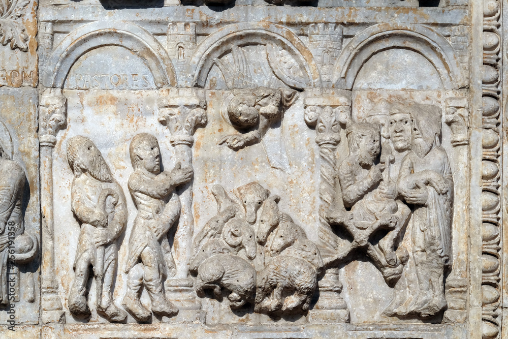 Bas-relief of Maestro Nicolo' (12th century), group to the right of the door of the Basilica of St Zeno, UNESCO World Heritage Site, in Verona, Italy