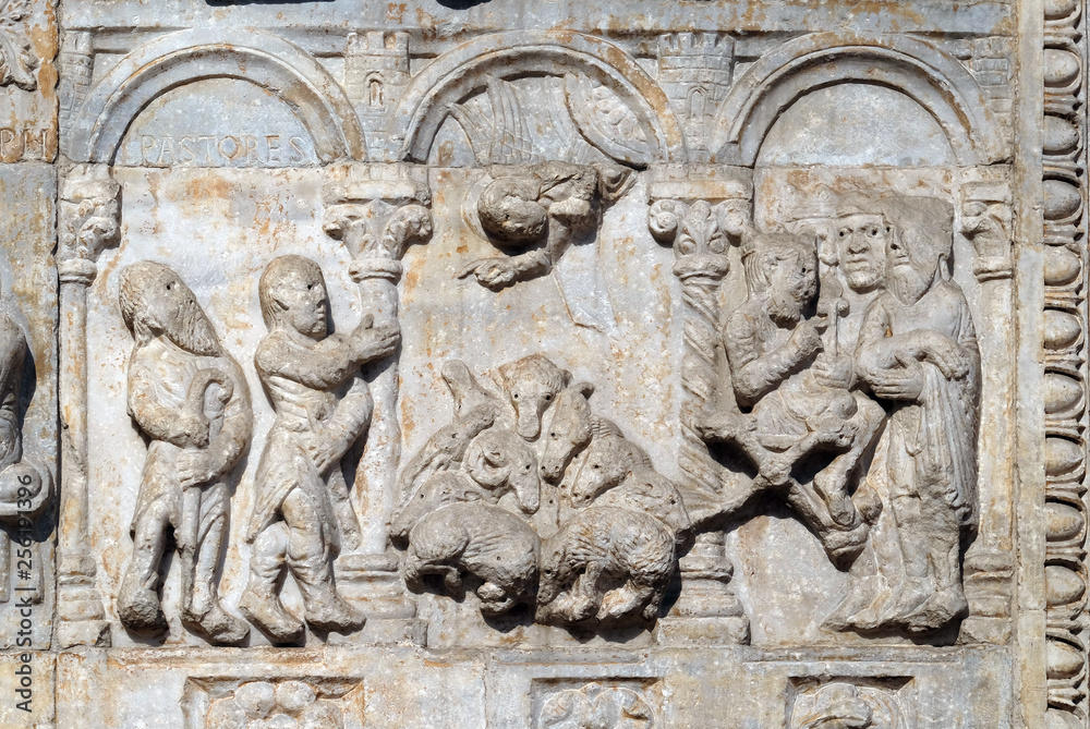 Bas-relief of Maestro Nicolo' (12th century), group to the right of the door of the Basilica of St Zeno, UNESCO World Heritage Site, in Verona, Italy