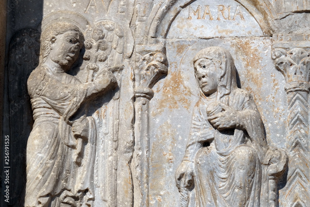 Annunciation of the Virgin Mary, medieval relief on the facade of Basilica of San Zeno in Verona, Italy