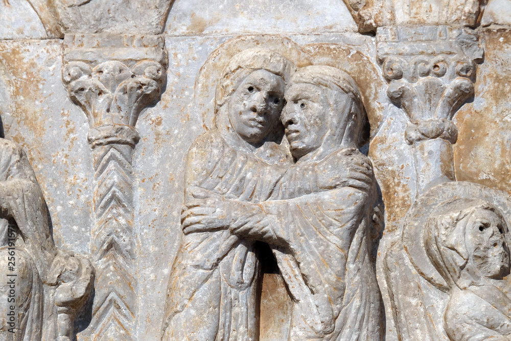 Visitation of the Virgin Mary, medieval relief on the facade of Basilica of San Zeno in Verona, Italy