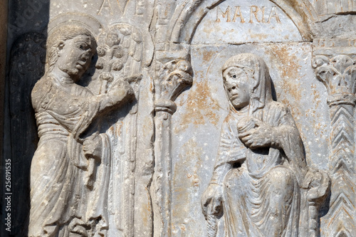Annunciation of the Virgin Mary, medieval relief on the facade of Basilica of San Zeno in Verona, Italy