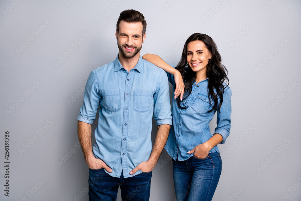 Portrait of charming millennial students workers freelancers entrepreneurs take decisions solutions achieve aims touching shoulders by arms dressed in blue denim outfit on ashy-gray isolated Portrait of charming millennial students workers freelancers entrepreneurs take decisions solutions achieve aims touching shoulders by arms dressed in blue denim outfit on ashy-gray isolated