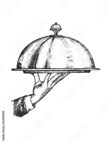 Elegant waiter hand holding tray under metal lid cover