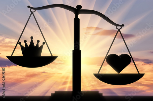 Symbol of the heart Altruism takes priority over the symbol of the crown of egoism on the scales of justice photo