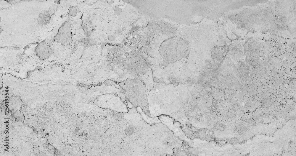 Full frame texture background of a weathered and abstract stone slab in black and white.