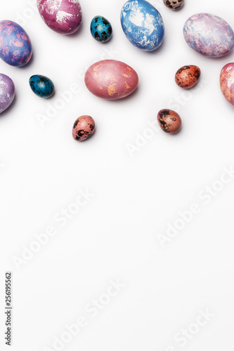Easter background with different color eggs isolated on white background