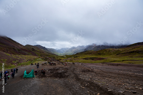 Crowd of tourists hiking up the Vinicunca   Rainbow mountain in south east Peru at al altitude of over 5000m. above sea