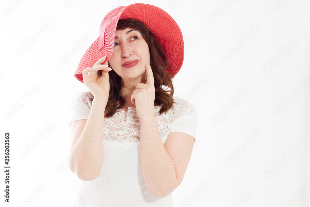 Happy woman in summer hat isolated on white background. Sun protection skin care and vacation holidays concept. Middle age female with white healthy teeth and menopause. Travel vacation. Copy space Happy woman in summer hat isolated on white background. Sun protection skin care and vacation holidays concept. Middle age female with white healthy teeth and menopause. Travel vacation. Copy space