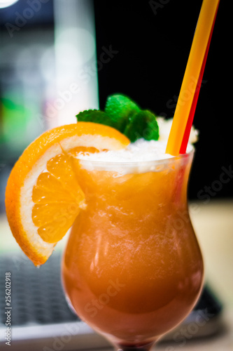 glass of juice orange mint straw