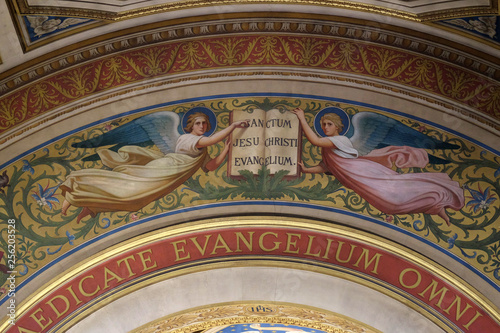 Two Angels Supporting the Book of the Gospels by Romain Cazes, the arch above the altar in the St Francis Xavier's Church in Paris, France 