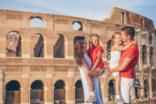 Photography Happy family in Rome over Coliseum background.