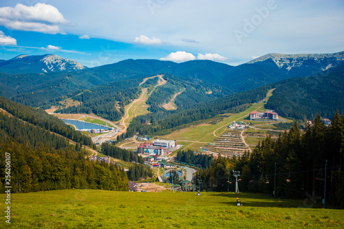 Beautiful landscape of summer mountains with blue sky. Summer mountain village landscape