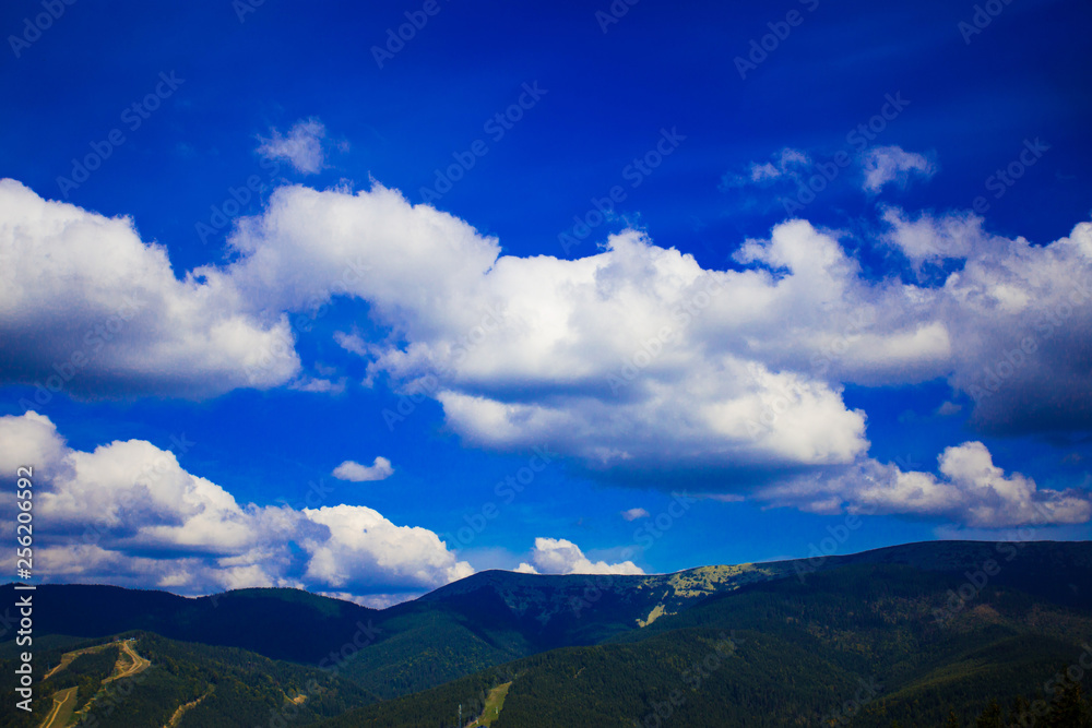 Blue sky background with tiny clouds in sunny day.