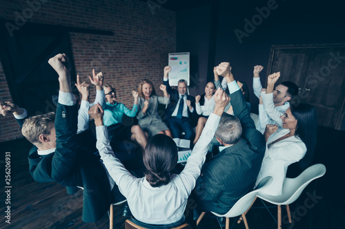 Nice stylish elegant cheerful cheery positive sharks marketers company ceo boss chief directors executive managers raising hands up at industrial loft interior work place space