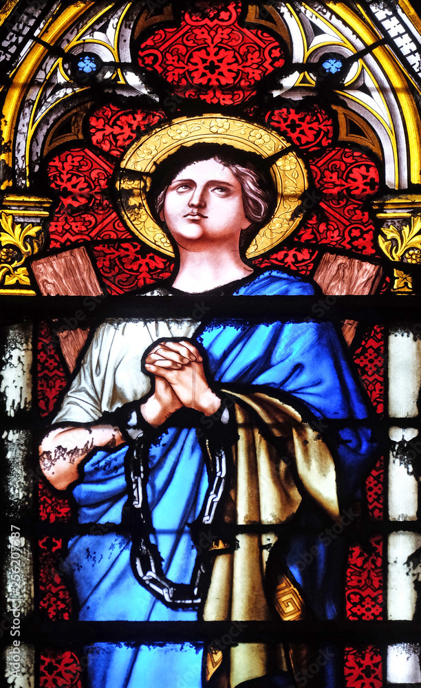 Fototapeta premium Saint Agatha of Sicily, stained glass window in the Basilica of Saint Clotilde in Paris, France