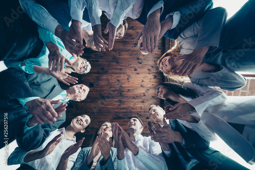 Fotografía Close up low angle view photo different age members business people stand circle