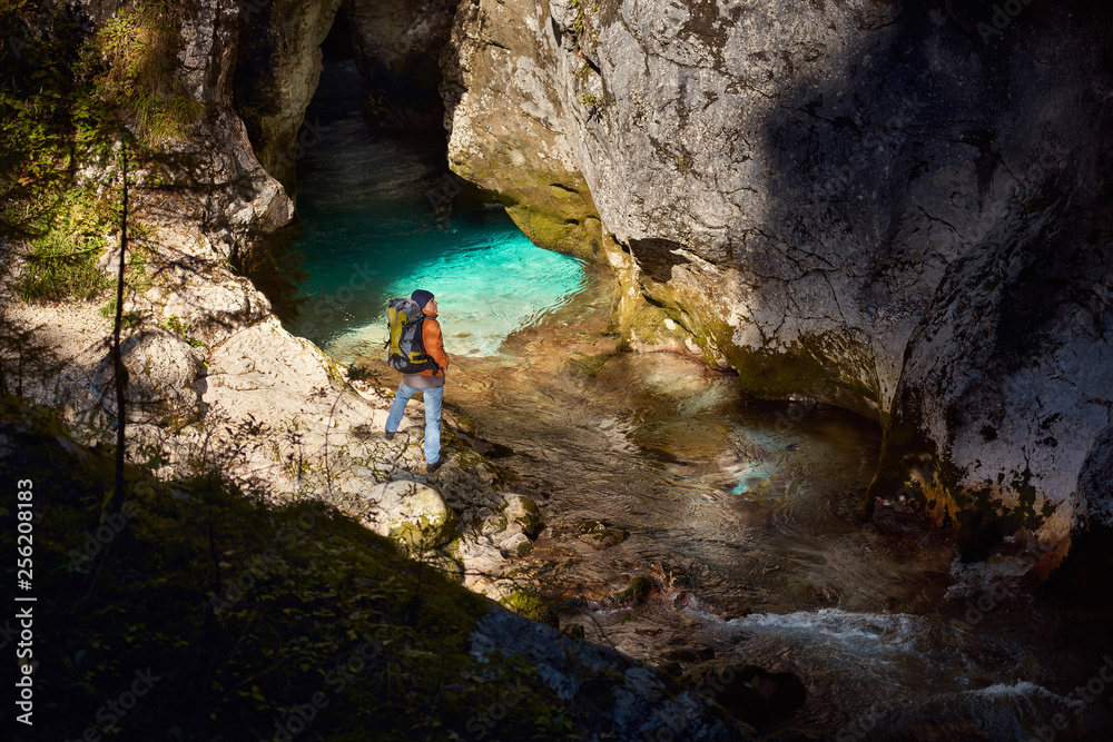 Hiker admires the beautiful canyon of Kamniska Bistrica