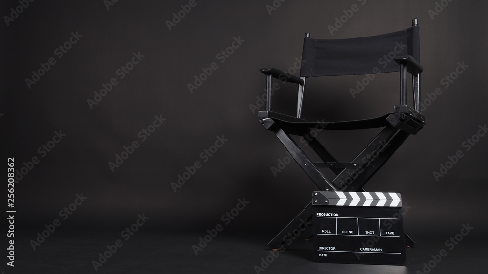 Clapper board or movie slate with director chair use in video production or movie and cinema industry. It's all black color.