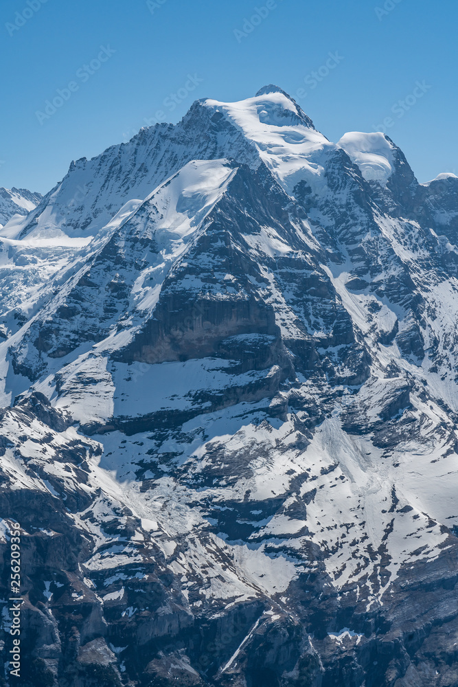 Obraz premium Switzerland, panoramic view on snow Alps with clouds