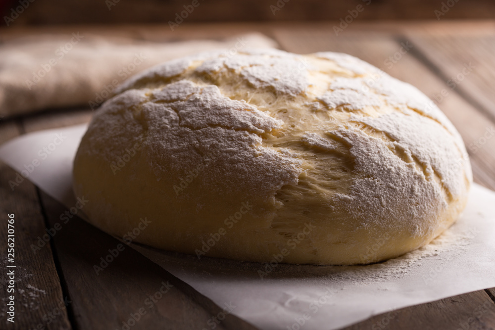 Dough and ingredients for it - eggs flour yeast on brown wooden background. Selective focus. Dough and ingredients for it - eggs flour yeast on brown wooden background. Selective focus.