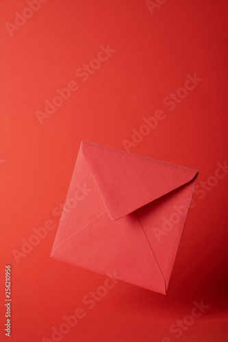 bright  colorful and empty envelope on red background with copy space