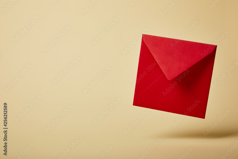 red and bright envelope on colorful and yellow background with copy space red and bright envelope on colorful and yellow background with copy space