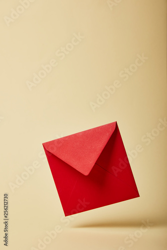 red and bright envelope on colorful and yellow background with copy space